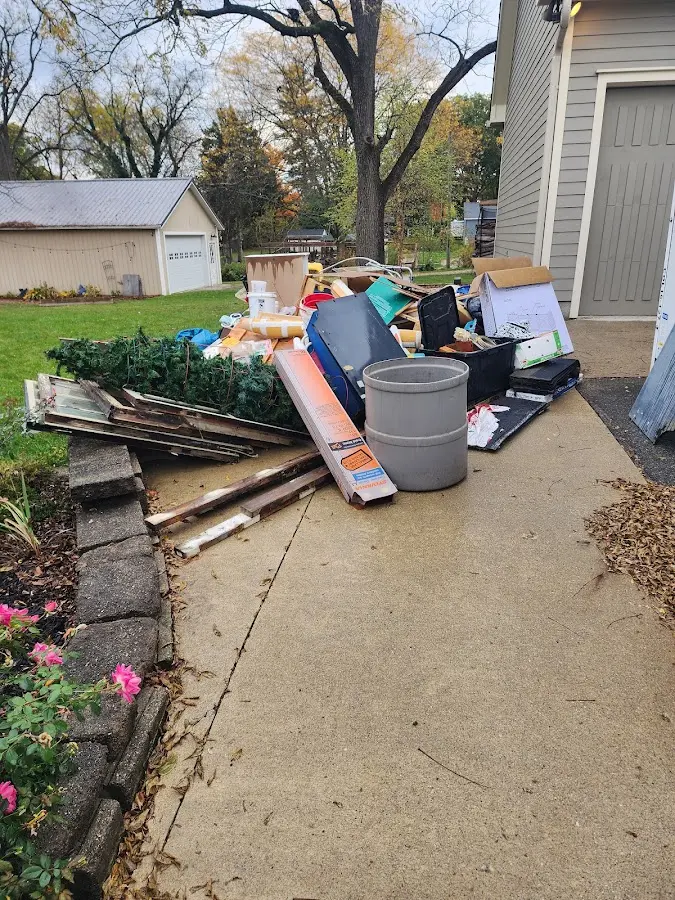 Dumpster being loaded with debris for 3 Yard Dumpster Rental in East Windsor